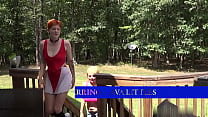A redhead and a blonde share a dick outdoors